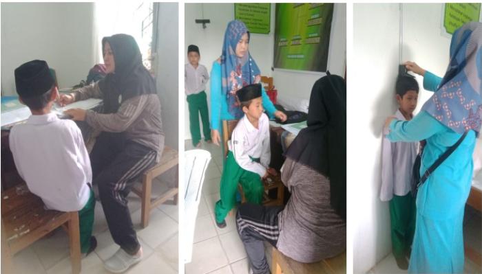 KEGIATAN PENGUKURAN TINGGI BADAN DAN BERAT BADAN TIM PUSKESMAS MUARA BULIAN DI MIN 1 BATANG HARI DALAM RANGKA  MEMANTAU PERTUMBUHAN DAN PERKEMBANGAN ANAK 